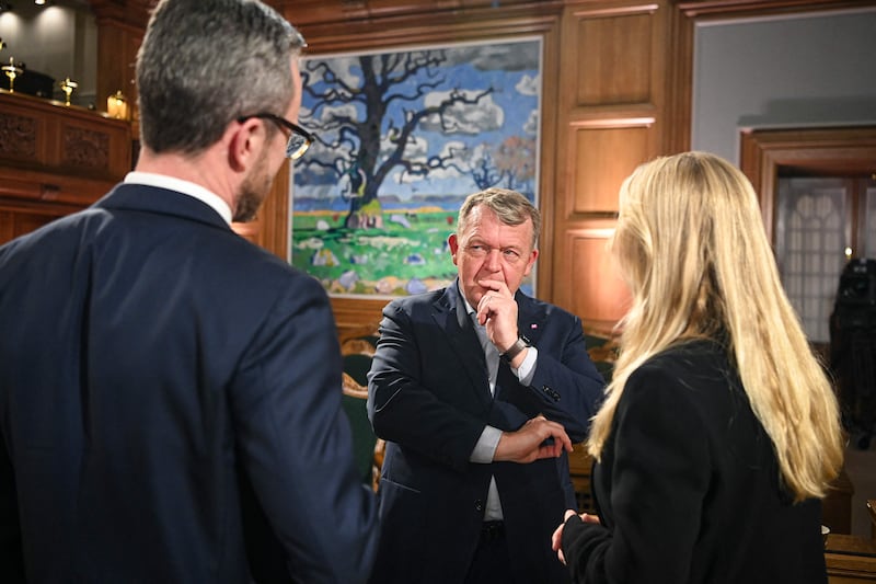 Lars Loekke Rasmussen, chairman of the Moderates Party, centre, in discussion with Jakob Ellemann-Jensen, leader of Denmark's Liberal Party, left, and Pernille Vermund, head of national conservative party the New Right, after a post-election debate at Christiansborg in Copenhagen. AFP