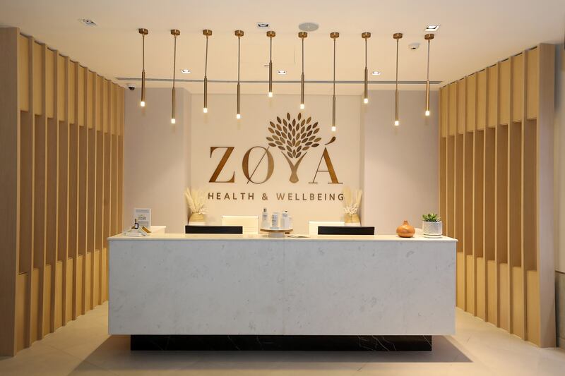 A reception area welcomes guests to the basement level of Zoya.