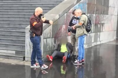 This grab taken from a video obtained by AFP shows French police detaining an alleged suspect after several people were injured near the former offices of the French satirical magazine Charlie Hebdo following an attack by a man wielding a knife in Paris on September 25, 2020.   A man armed with a knife seriously wounded two people on September 25, 2020, in a suspected terror attack outside the former offices of French satirical weekly Charlie Hebdo in Paris, three weeks into the trial of men accused of being accomplices in the 2015 massacre of the newspaper's staff. Charlie Hebdo had angered many Muslims around the world by publishing cartoons of the Prophet Mohammed, and in a defiant gesture ahead of the trial this month, it reprinted the caricatures on its front cover.
 / AFP / Laura CAMBAUD
