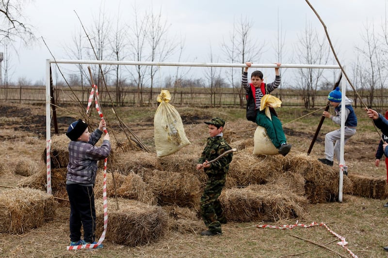 Children play at a goalpost during the traditional Cossack games in North Ossetia, Alania, Russia. Eduard Korniyenko / Reuters
