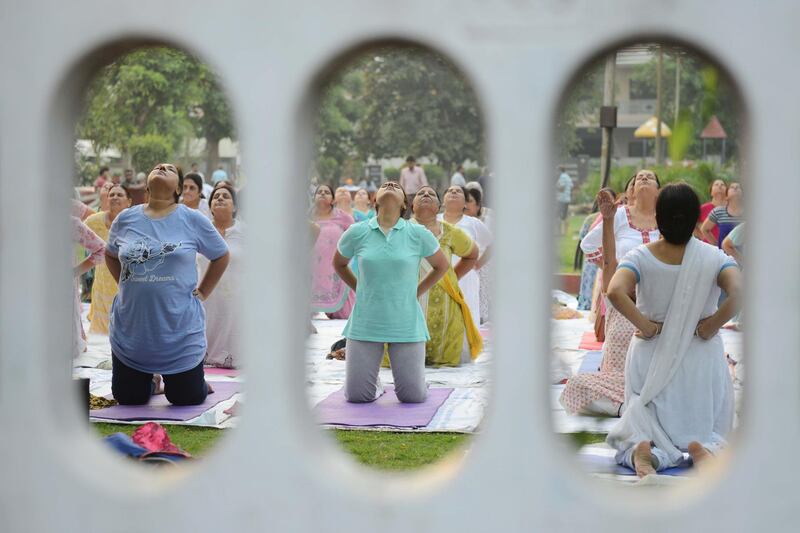Indian yoga practitioners take part in a yoga session ahead of International Yoga Day at a park in Amritsar. Narinder Nanu / AFP Photo