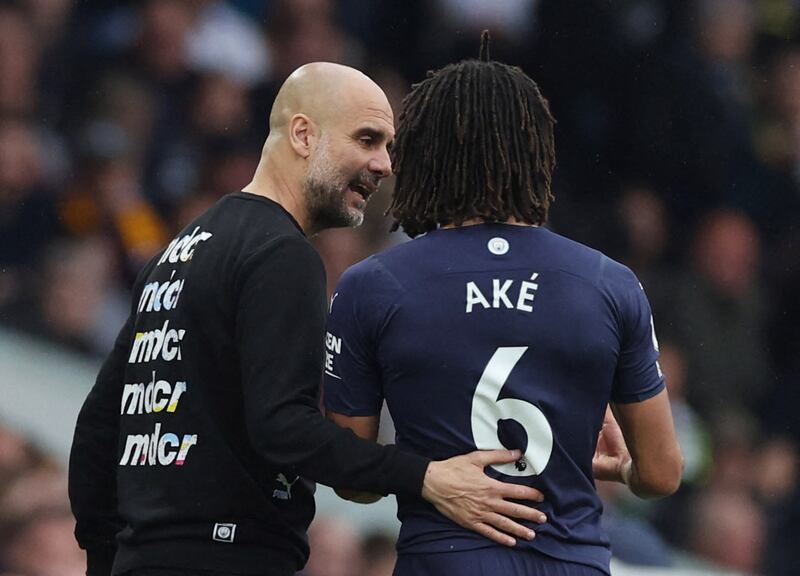 Ake speaks with manager Pep Guardiola after being substituted. Reuters