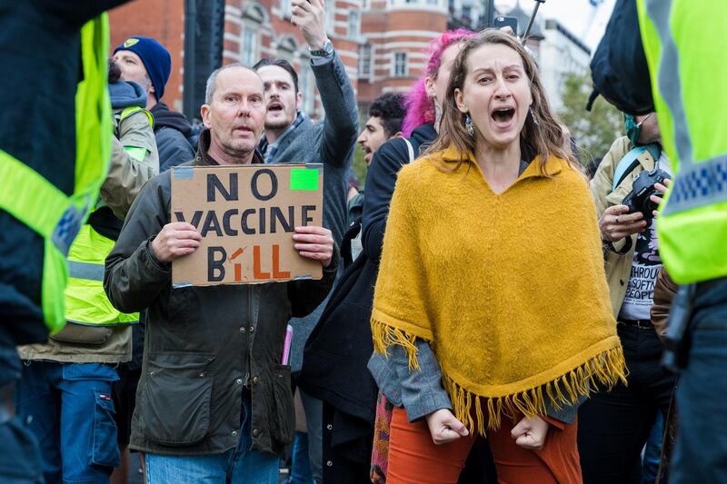 Anti-lockdown protesters clash with police during a demonstration against lockdown measures in Westminster, London.  EPA