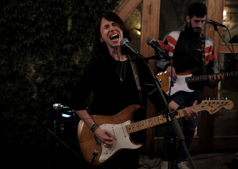 Rock musician Joy Fayad playing a gig in Baabdat, east of Beirut. She hopes her music can lift her audience and help them release their frustrations.