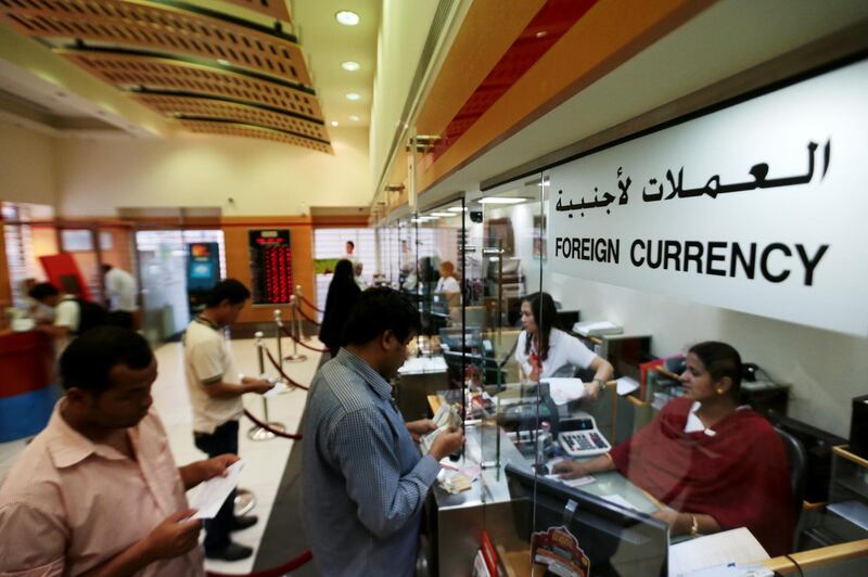 Abu Dhabi, United Arab Emirates, July 15, 2014:    Expatriates send funds to their home countries at the UAE Exchange at the Malabar Gold Building location in Abu Dhabi on July 15, 2014. Christopher Pike / The National

Reporter:  N/A
Section: News



