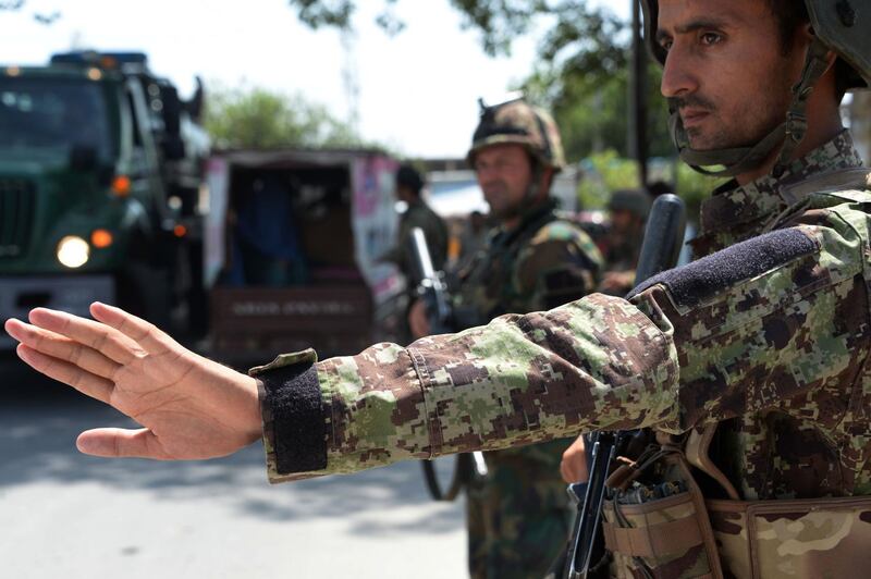 (FILES) In this file photo taken on August 1, 2018 Afghan National Army (ANA) soldiers search vehicles at a checkpoint in Jalalabad. - Afghan President Ashraf Ghani declared a provisional three-month ceasefire with the Taliban in a televised broadcast August 19, but said the truce would hold only if the insurgents reciprocated. (Photo by NOORULLAH SHIRZADA / AFP)
