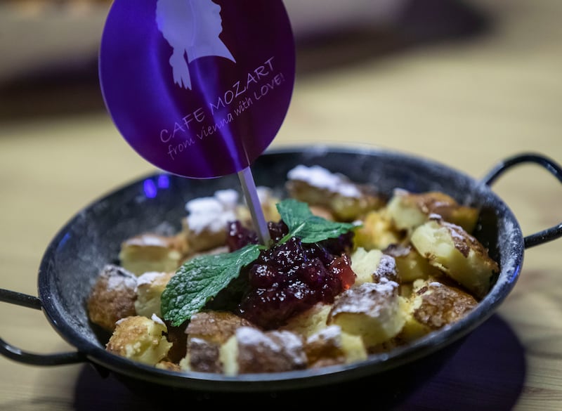 Kaiserschmarrn cake at Mozart Cafe. Imagine a giant, fluffy pancake torn into bite-sized pieces, and you get this Austrian classic. Also called the emperor's mess because of its scrambled presentation, it is served with sweet plum jam. 