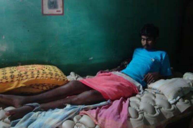 Twenty-year-old S. Shoban Babu has spent most of the past year lying in a dim room, recovering from traumatic paraplegia. He says that senior students threw him out of a fourth floor window. PHOTO CREDIT: K.T. Gandhirajan
 
