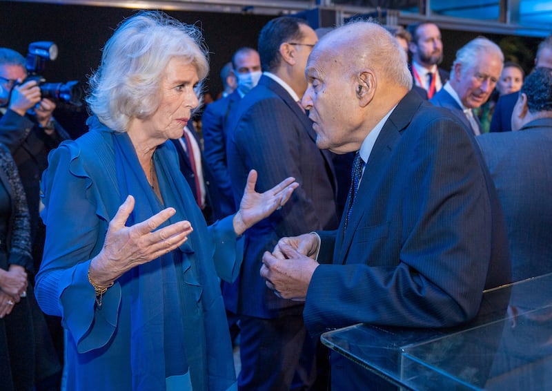 Camilla, Duchess of Cornwall, wearing blue Anna Valentine, talks with Magdi Yacoub, retired heart surgeon, during a UK-Egypt reception in Cairo on November 18. Reuters