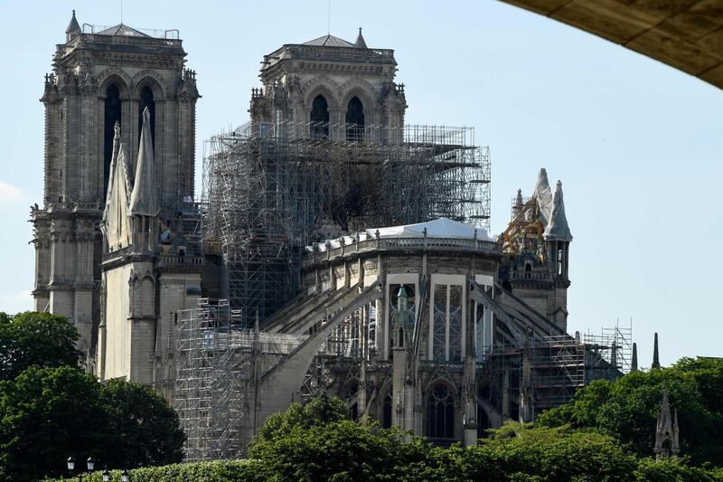 A picture taken on May 31, 2019 shows scaffoldings set up on Notre-Dame de Paris cathedral, under repair after it was badly damaged by a huge fire on April 15, in the French capital Paris. / AFP / Bertrand GUAY
