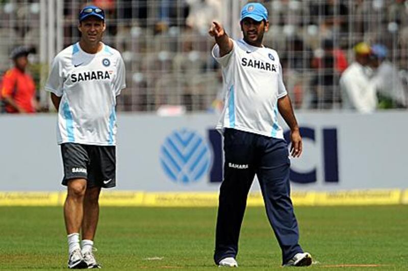 Gary Kirsten, left, is content being behind the scenes.