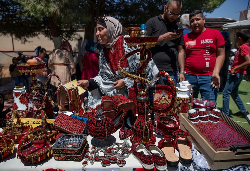 Products decorated with traditional Palestinian embroidery for sale at the market in Beita.