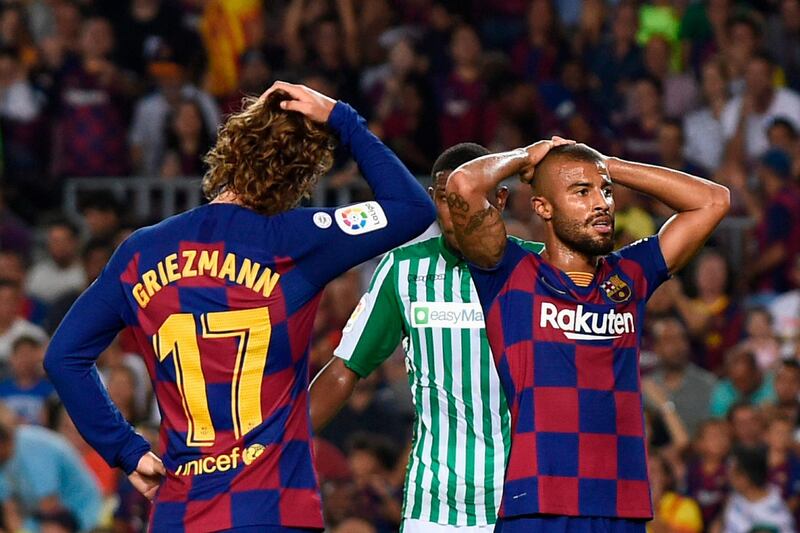 Barcelona's Brazilian midfielder Rafinha French forward Antoine Griezmann react after going 1-0 down to Betis. AFP