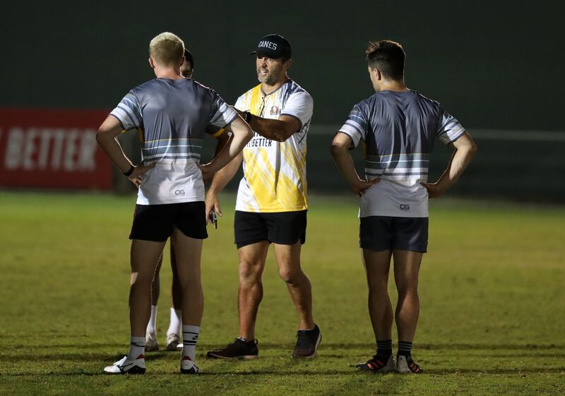 Dubai Hurricanes head coach Henry Paul speaks to his players during the practice at The Sevens, Dubai.