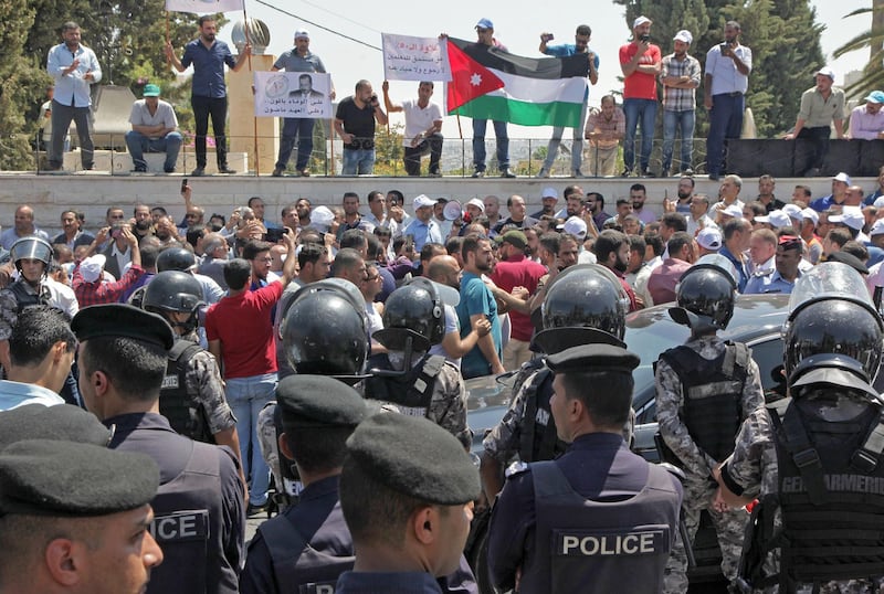 Jordanian teachers display their national flag during a protest capital Amman.  AFP