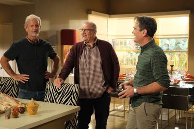 This image released by ABC shows, from left, executive producer Christopher Lloyd, and actors Ed O'Neill and Ty Burrell on the set of "Modern Family." ABCâ€™s â€œModern Familyâ€ ends its 11-season run with a two-hour finale on Wednesday. (Tony Rivetti/ABC via AP)
