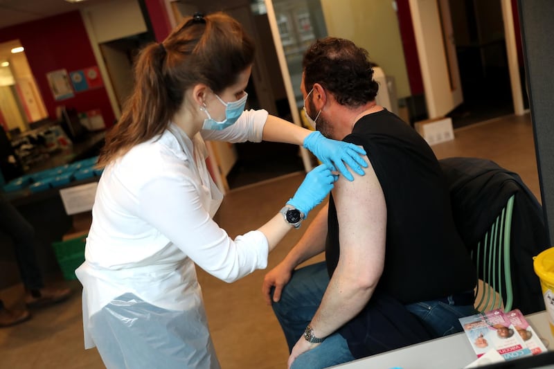 Clinical Pharmacist Ellie Morton administers the Oxford/AstraZeneca vaccine at the community vaccination centre at Kingston University's Penrhyn Road campus in London. Getty Images