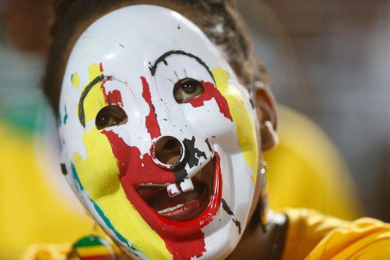 Zimbabwe's soccer team supporter cheers during the group A soccer match between Egypt and Zimbabwe, the opening match of the Africa Cup of Nations at Cairo International Stadium in Cairo, Egypt, Friday, June 21, 2019. (AP Photo/Ariel Schalit)