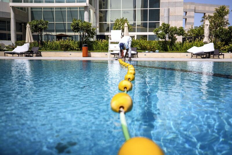 Abu Dhabi, United Arab Emirates, July 23, 2020.   
Le Royal Meridien Hotel  Abu Dhabi Covid-19 swimming pool sanitation operations.
Victor Besa  / The National
Section: NA
For:  Standalone / Stock Images