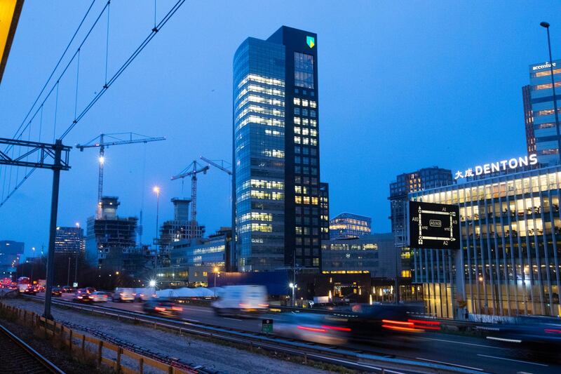 The ABN AMRO head office is seen in the capital's business district, in Amsterdam, Netherlands, Monday, March 2, 2020. Dutch bank ABN AMRO has agreed to pay 480 million euros ($574 million) as part of a settlement with prosecutors who accused the state-owned bank of "serious shortcomings" in tackling money laundering, prosecutors and the bank said Monday, April 19, 2021. (AP Photo/Peter Dejong)