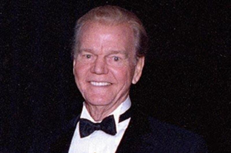 The broadcasting pioneer Paul Harvey poses at the Hall of Fame in Chicago.