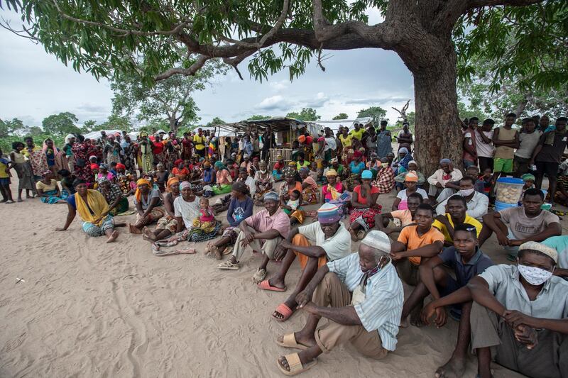 Internally displaced persons gather for a community meeting in the Tara Tara district of Matuge, northern Mozambique, February 24, 2021. - The place functions as a center for internally displaced persons (IDPs) who fled their communities due to attacks by armed insurgents in the northern part of the Cabo Delgado province. Currently, there are 500 families, according to government figures. (Photo by Alfredo Zuniga / AFP)
