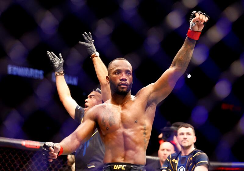 Leon Edwards celebrates after defending his world welterweight title against Kamaru Usman at UFC 286 in London, on March 18, 2023. Reuters