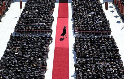 BOSTON, MA - MAY 21: A graduate crosses the red carpet during the Boston College commencement at Alumni Stadium in Boston on May 21, 2018. (Photo by David L. Ryan/The Boston Globe via Getty Images)