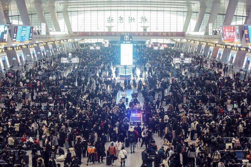 Passengers arrive at Hankou railway station. AFP