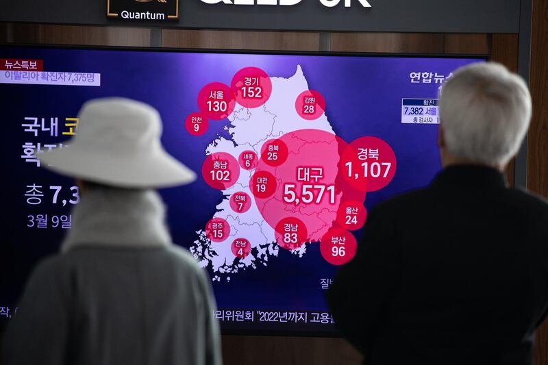 South Koreans watch TV news for information on the coronavirus epidemic, in Seoul, South Korea.  EPA