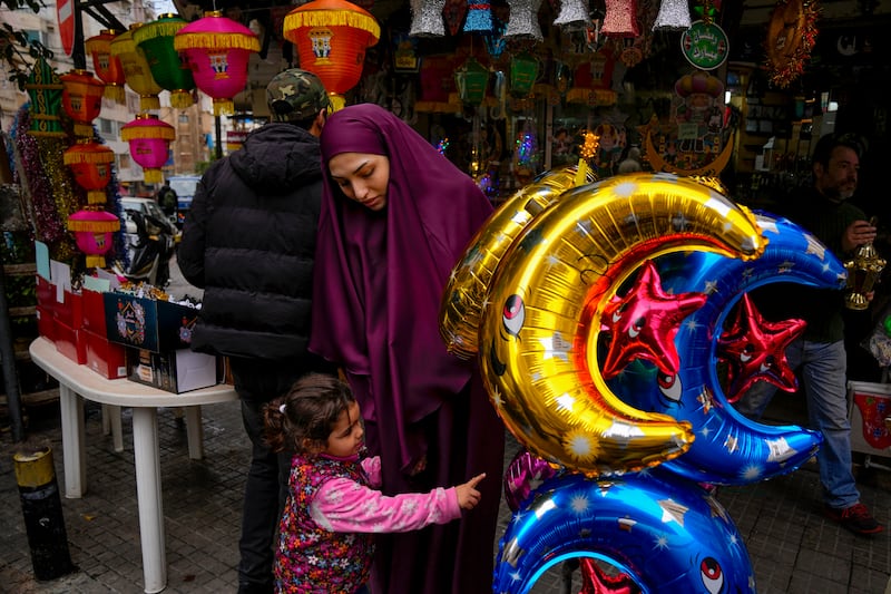 People shop for decorations at a shop in Beirut, Lebanon. AP