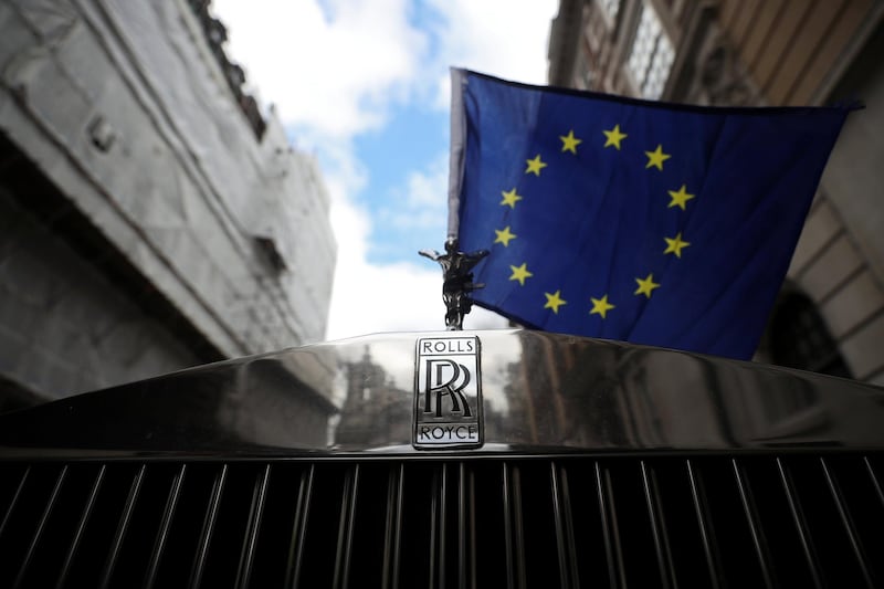 A Rolls Royce car with an EU flag attached to it is seen on a street in London, Britain, March 27, 2019. REUTERS/Hannah McKay
