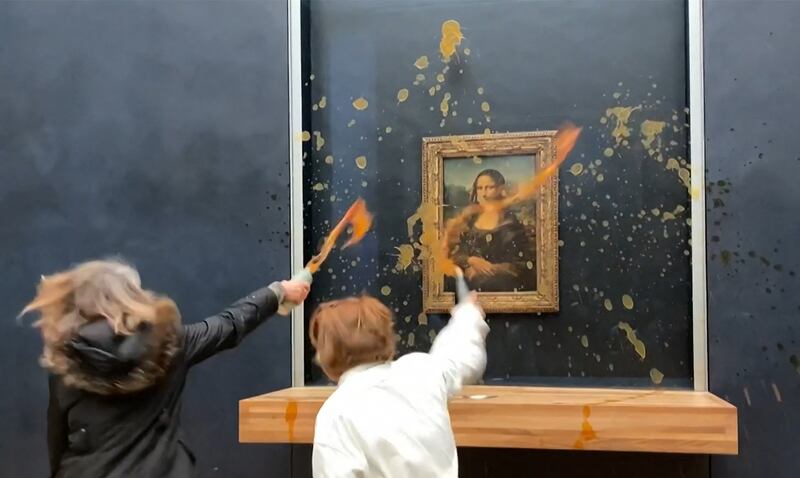 Protesters throw soup at the Mona Lisa at the Louvre art gallery in Paris, France. AFP