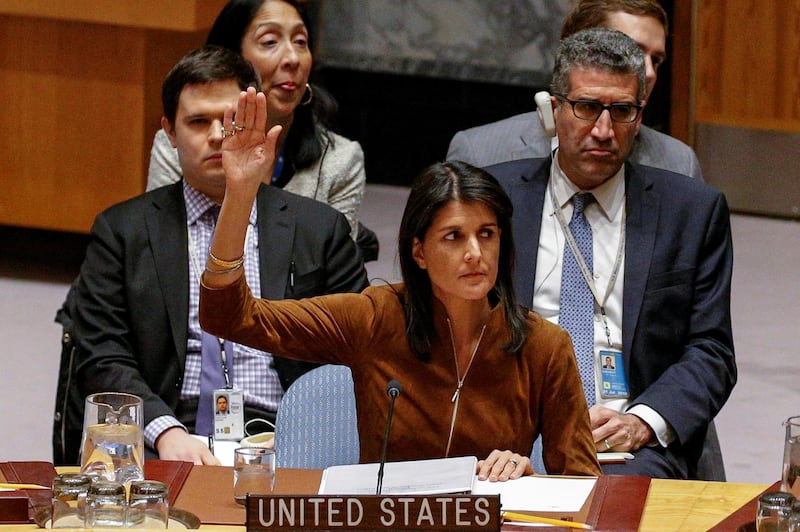 U.S. Ambassador to the United Nations Nikki Haley votes for a bid to renew an international inquiry into chemical weapons attacks in Syria, during a meeting of the U.N. Security Council at the United Nations headquarters in New York, U.S., November 17, 2017.  REUTERS/Brendan McDermid