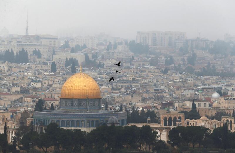 Birds fly on a foggy day near the Dome of the Rock, located in Jerusalem's Old City on the compound known to Muslims as Noble Sanctuary and to Jews as Temple Mount, Jerusalem, January 2, 2018. REUTERS/Ammar Awad