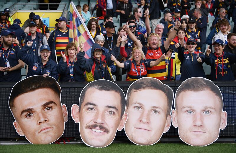 Crows fans celebrate a win during the round four AFL match between Adelaide Crows and Fremantle Dockers at Adelaide Oval in Adelaide, Australia. Getty 