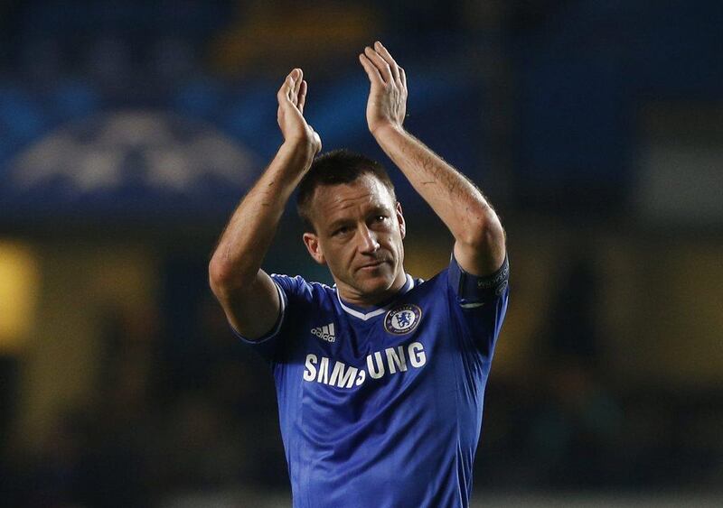 John Terry and Chelsea finished atop Group E with 12 points from six matches. Sang Tan / AP
