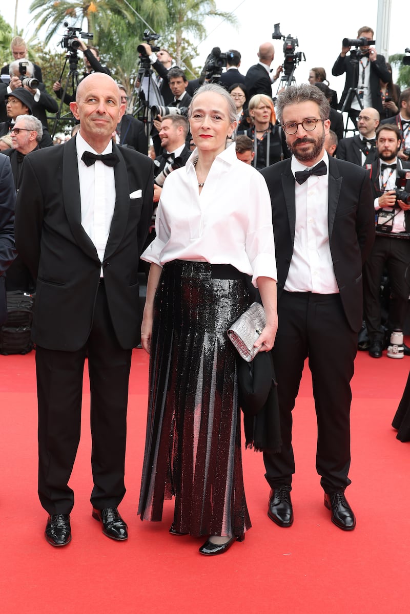 Keeping things simple, Delphine Ernotte, centre, wears white shirt and shredded black skirt. Getty