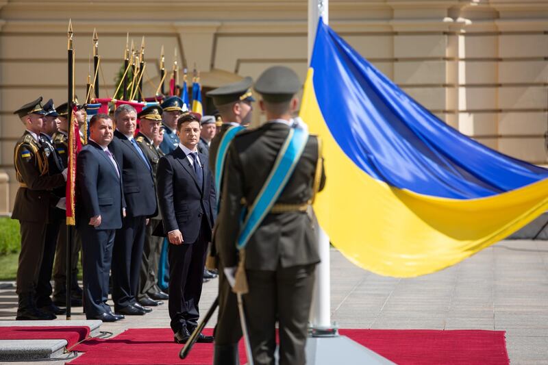 Ukraine's new president Volodymyr Zelenskiy attends a flag raising ceremony after hisÊinaugurationÊin Kiev, Ukraine May 20, 2019.ÊPavel Zmey/Ukrainian Presidential Press Service/Handout via REUTERS ATTENTION EDITORS - THIS IMAGE WAS PROVIDED BY A THIRD PARTY.