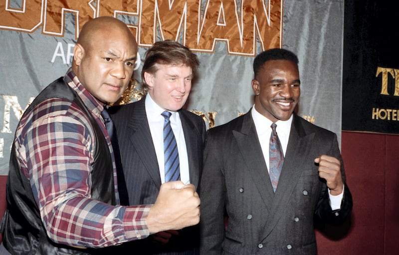 ATLANTIC CITY, NJ - CIRCA 1991: George Foreman, Donald Trump and Evander Holyfield pose during a press conference to promote their upcoming fight on April 19,1991 in Atlantic City, New Jersey. (Photo by: The Ring Magazine via Getty Images) 