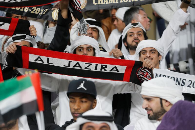 Al Jazira fans hold up banners before the match. Reuters