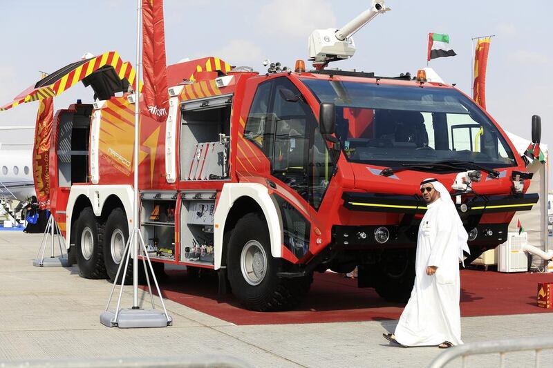 A man walks past the Naffco Fire Rescue vehicle on display at the Dubai Airshow. Sarah Dea/The National