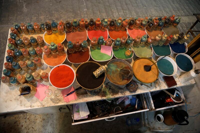 Supplies of coloured sand at Al-Awawda's shop. Reuters