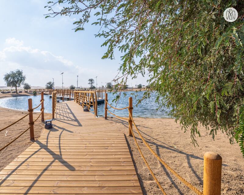 The site features floating pontoons and walkways across the lake. Photo: Abu Dhabi Department of Municipalities and Transport