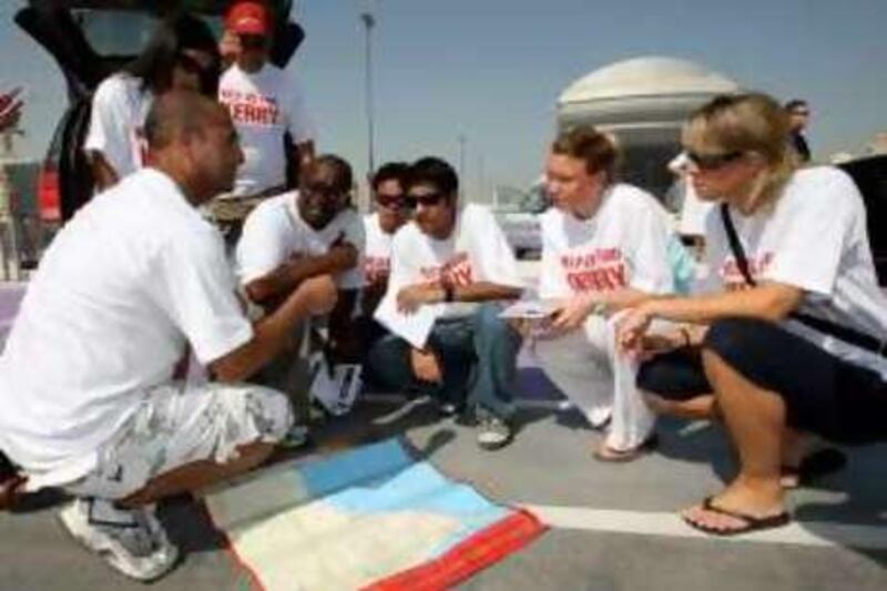 
DUBAI, UNITED ARAB EMIRATES- Sep 5:  Kurt Winter (left) brother of Kerry Winter talking to Volunteers who are spreading awareness about Missing Kerry Winter and gathered at Mall of the Emirates in Dubai. ( Pawan Singh / The National ) *** Local Caption ***  PS003- KERRY.jpg