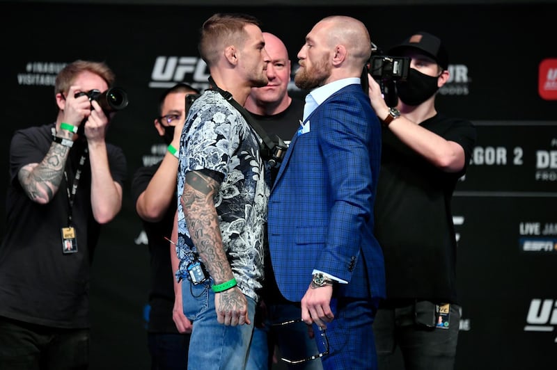 ABU DHABI, UNITED ARAB EMIRATES - JANUARY 21:  (L-R) Opponents Dustin Poirier and Conor McGregor pose face off for media during the UFC 257 press conference event inside Etihad Arena on UFC Fight Island on January 21, 2021 in Yas Island, Abu Dhabi, United Arab Emirates. (Photo by Jeff Bottari/Zuffa LLC via Getty Images)