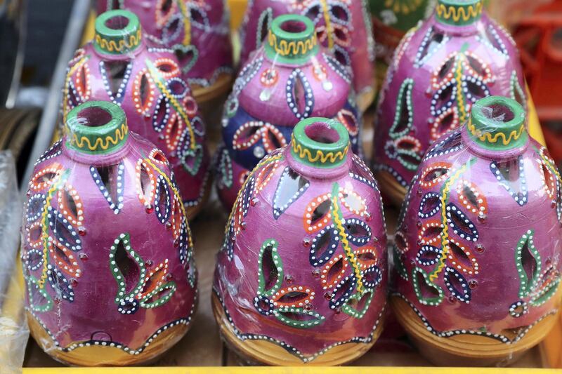 DUBAI, UNITED ARAB EMIRATES , November 1 – 2020 :- Colourful clay diyas (lamp) for Diwali festival on display outside the shop in Bur Dubai in Dubai. Diwali is the Indian festival of lights and this year it will be on 14th November. (Pawan Singh / The National) For News/Standalone/Online/Instagram/Big Picture 