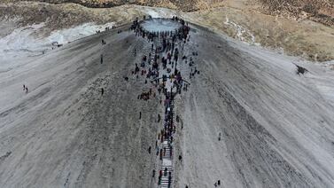Hindu devotees walk towards a mud volcano to start Hindu pilgrims' religious rituals for an annual festival in an ancient cave temple of Hinglaj Mata in Pakistan's southwestern Baluchistan province. AP Photo