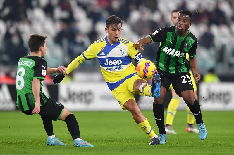 Paulo Dybala up against Maxime Lopez and Hamed Traore during the Coppa Italia match between Juventus and Sassuolo at Allianz Stadium on February 10, 2022 in Turin. Getty Images