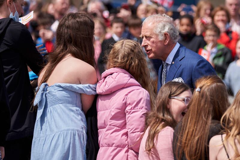Britain's Prince Charles greets people as he arrives at the Confederation Building in St John’s. AFP